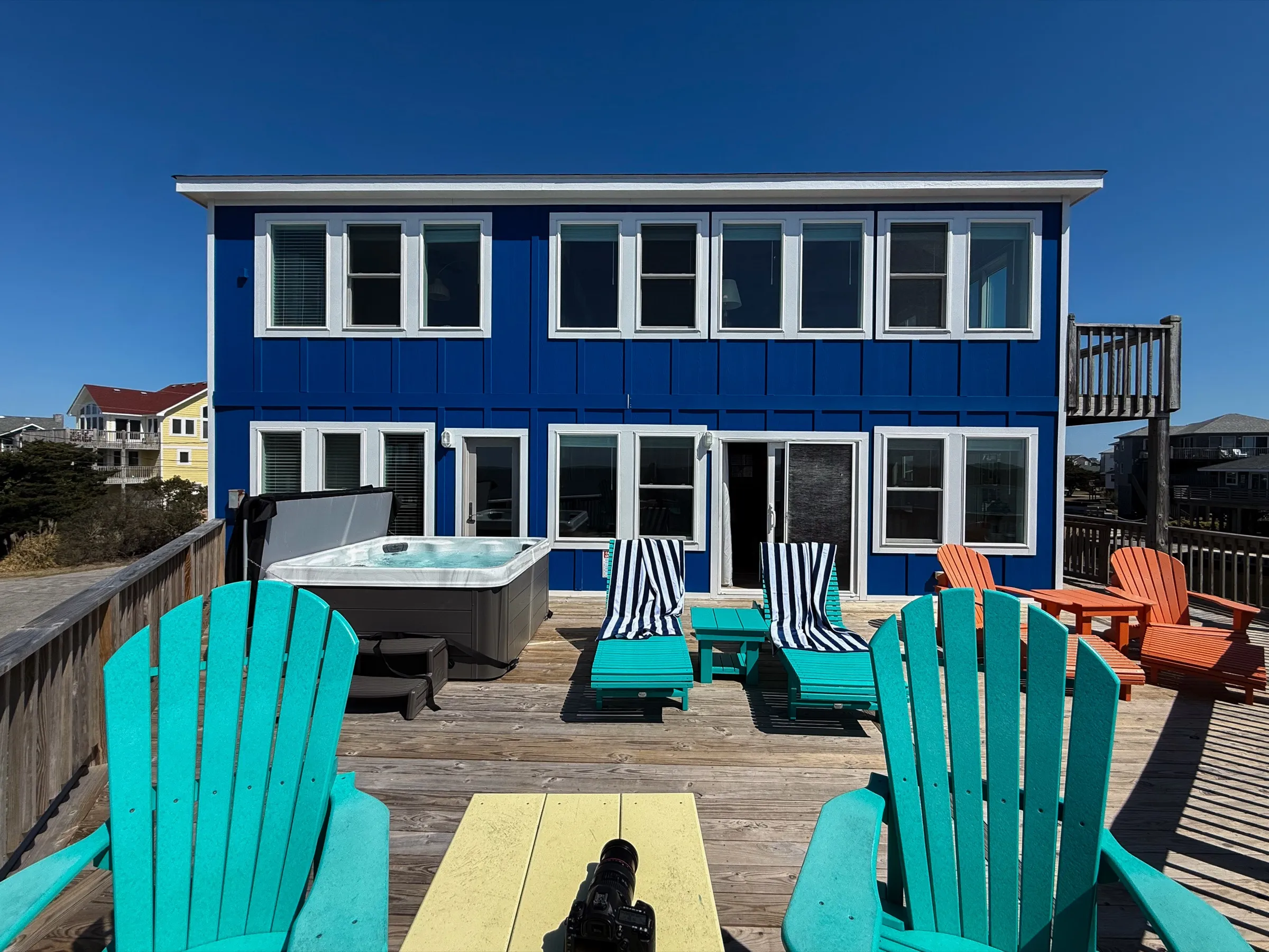 Waterfront deck with chairs at Bluebird Cottage
