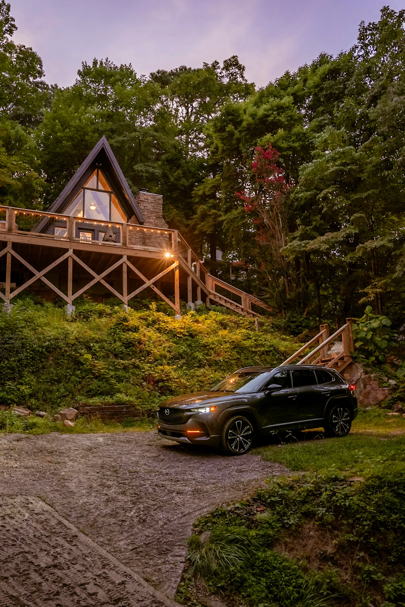 A-frame exterior at twilight with driveway at Après Chalet