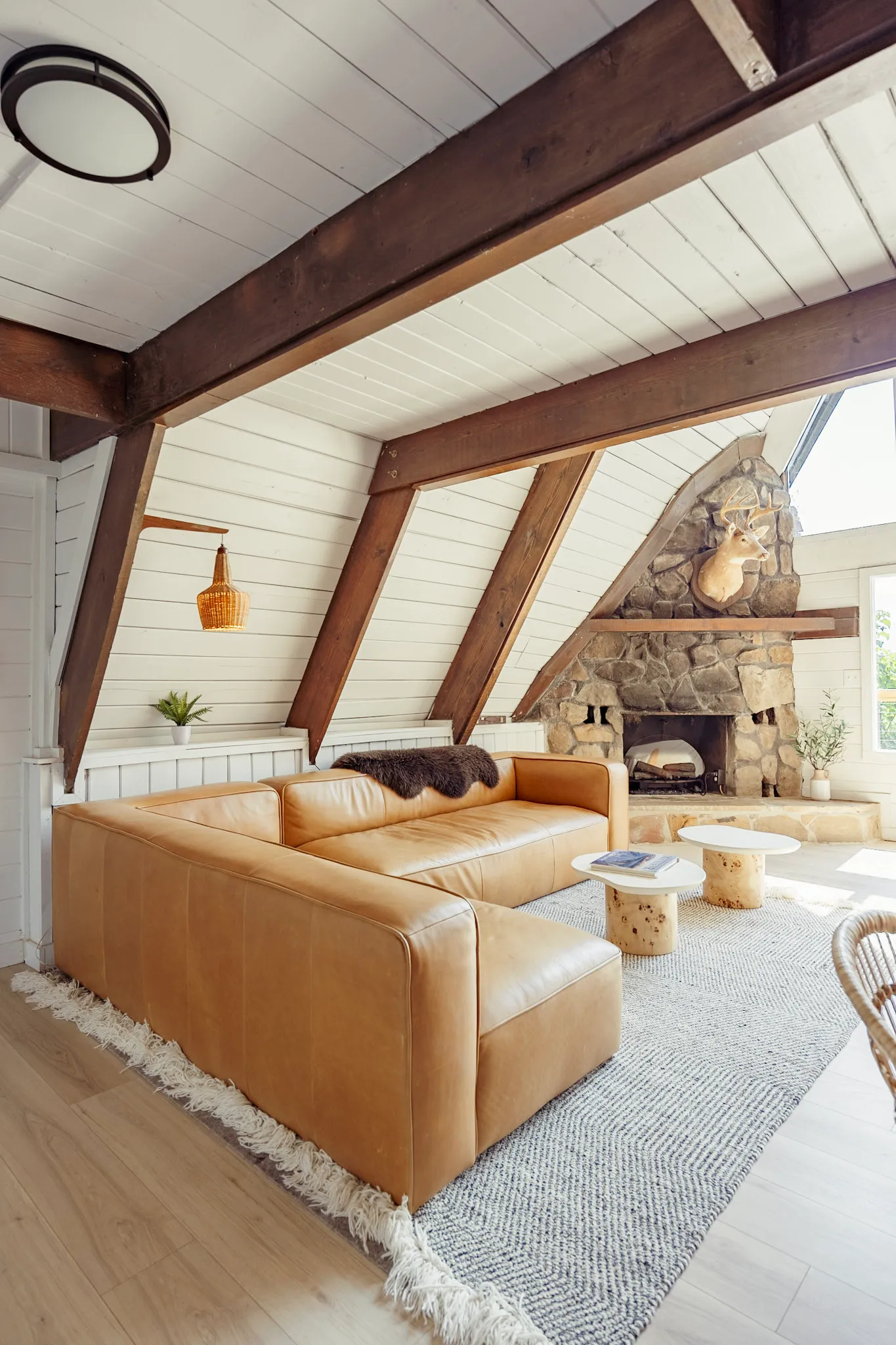 Leather sectional under the A-frame beams at Après Chalet