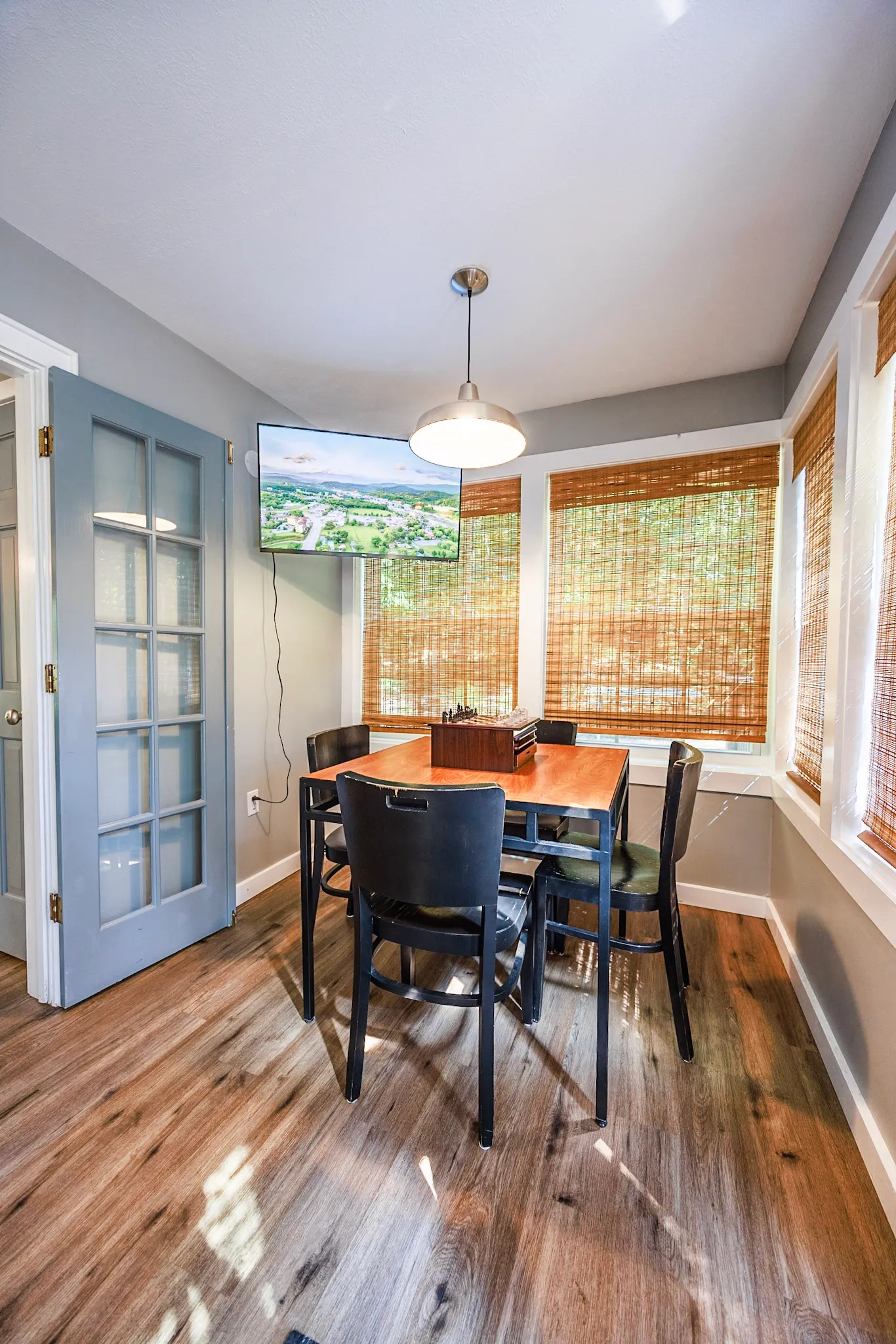 Dining nook with wall mounted tv at Hygge Blue Chalet
