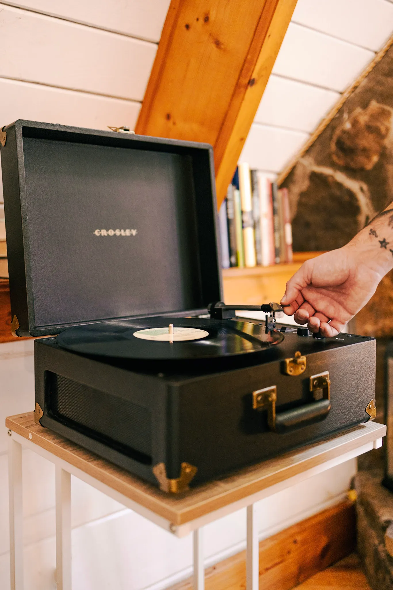 Vintage record player detail in the living room at Little Green Cabin