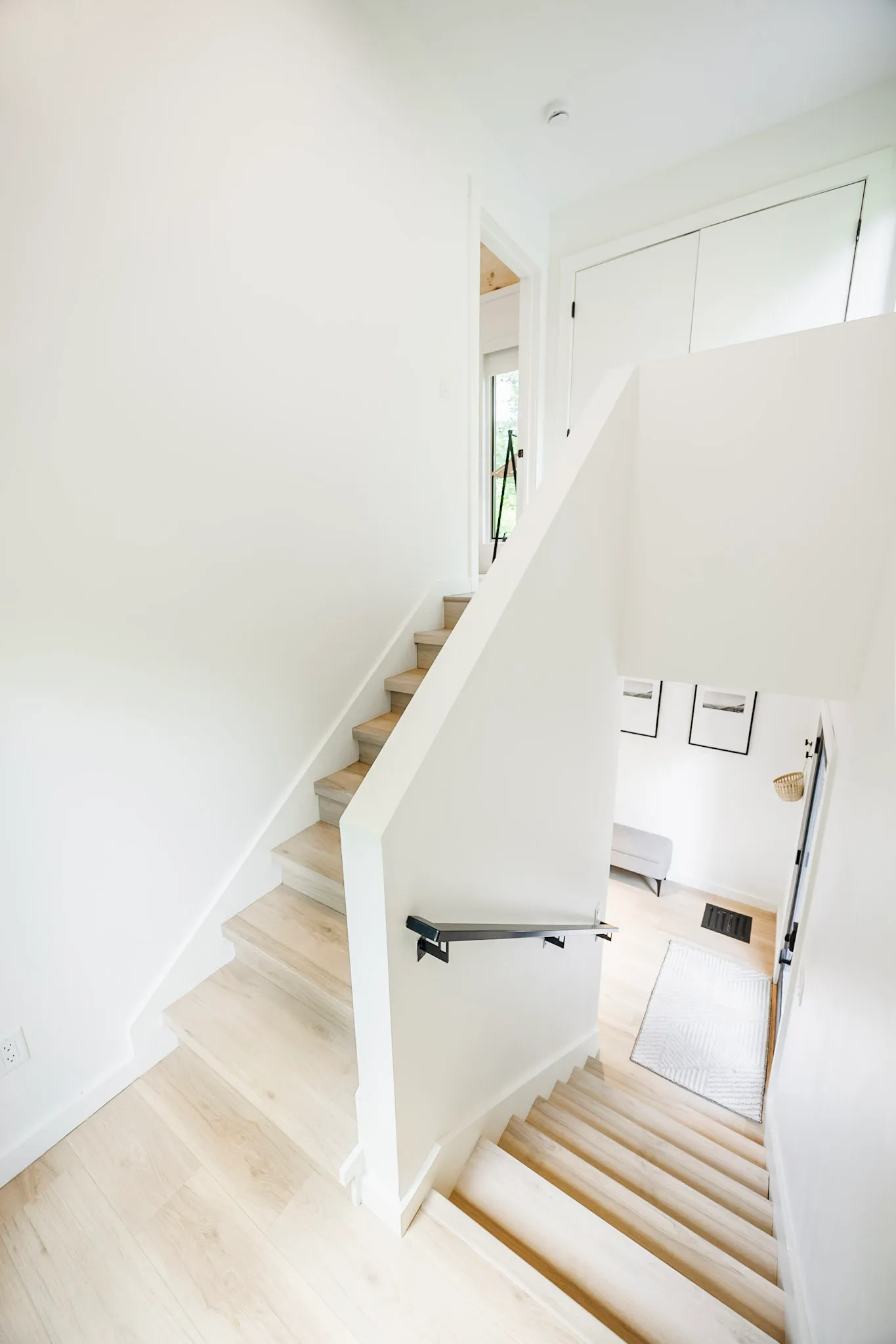Staircase landing with view down to the entry at Nordic Haus