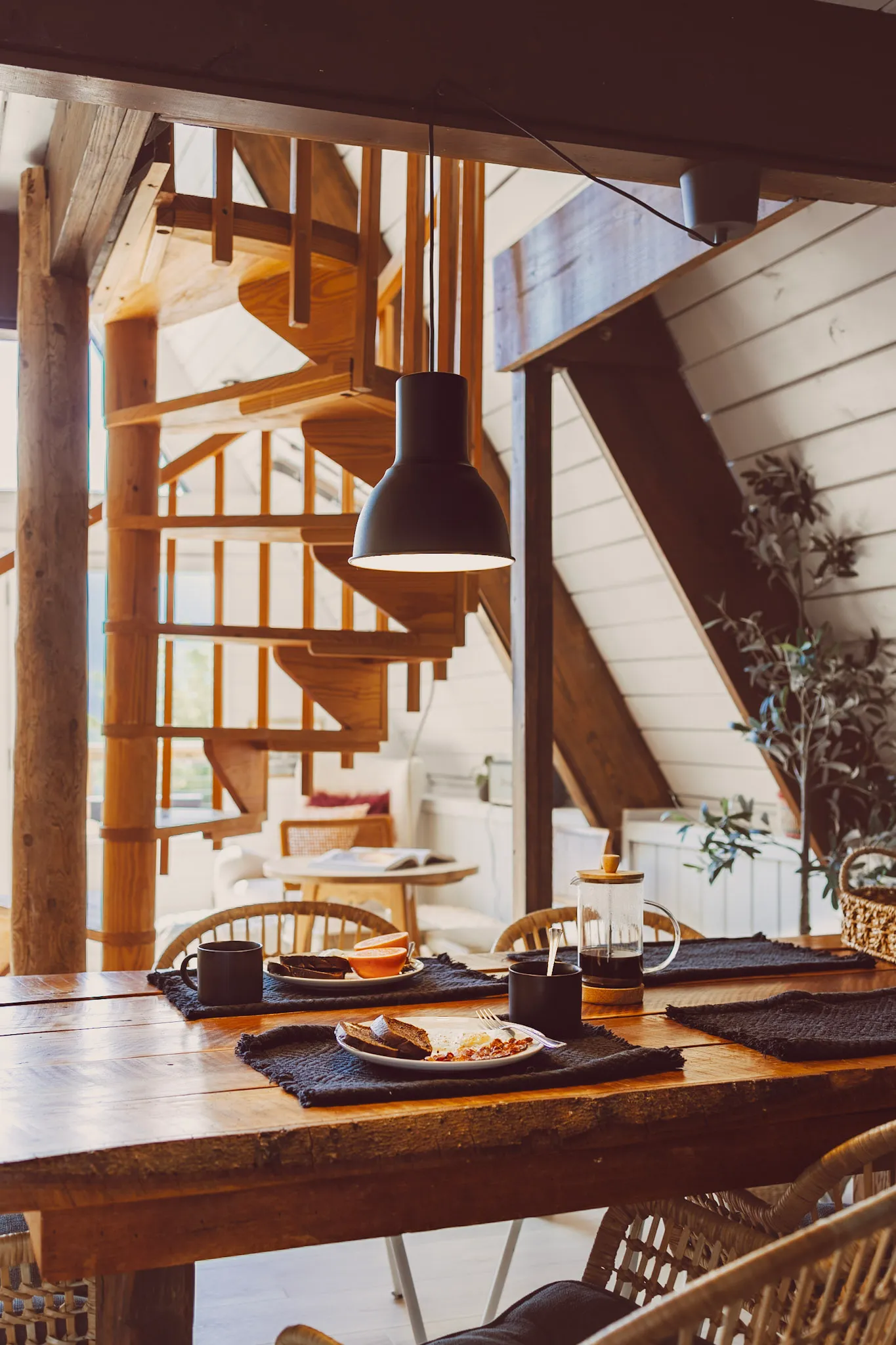 Dining table place settings under the pendant light at Après Chalet