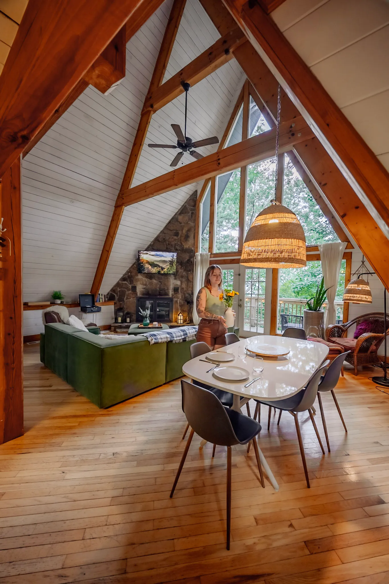 Dining table with living room beyond at Little Green Cabin