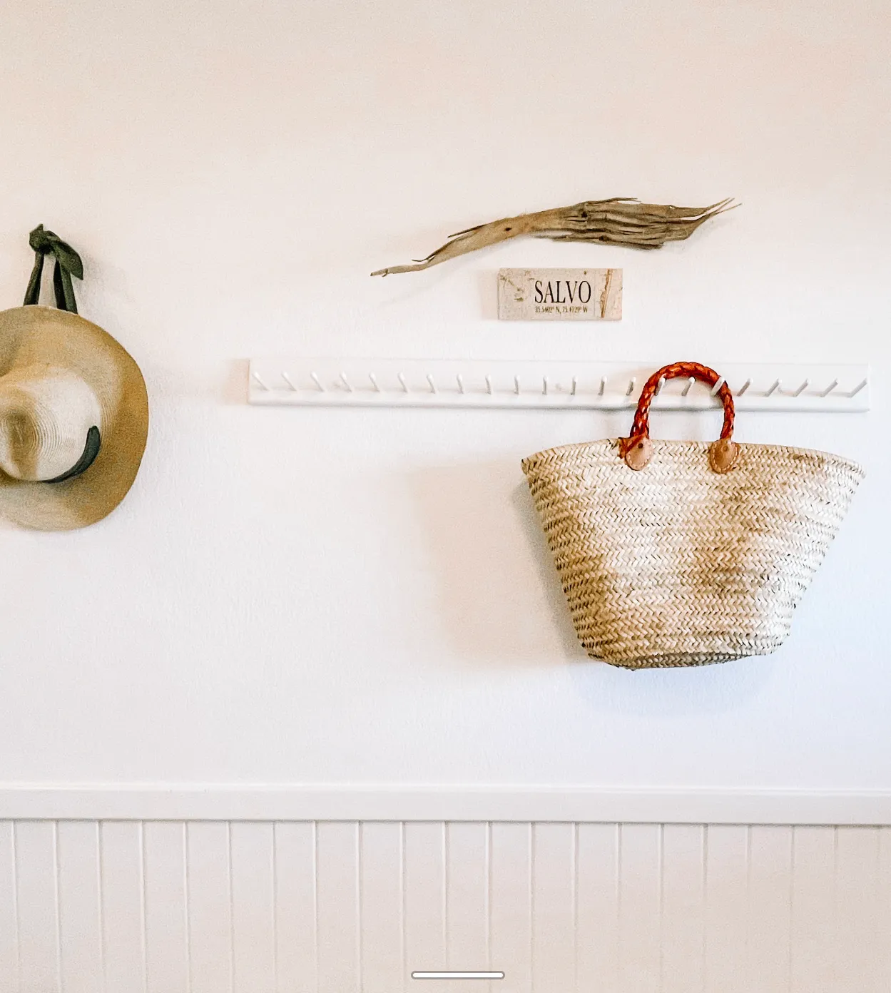 Entryway with beach hat and tote at Dune Haus
