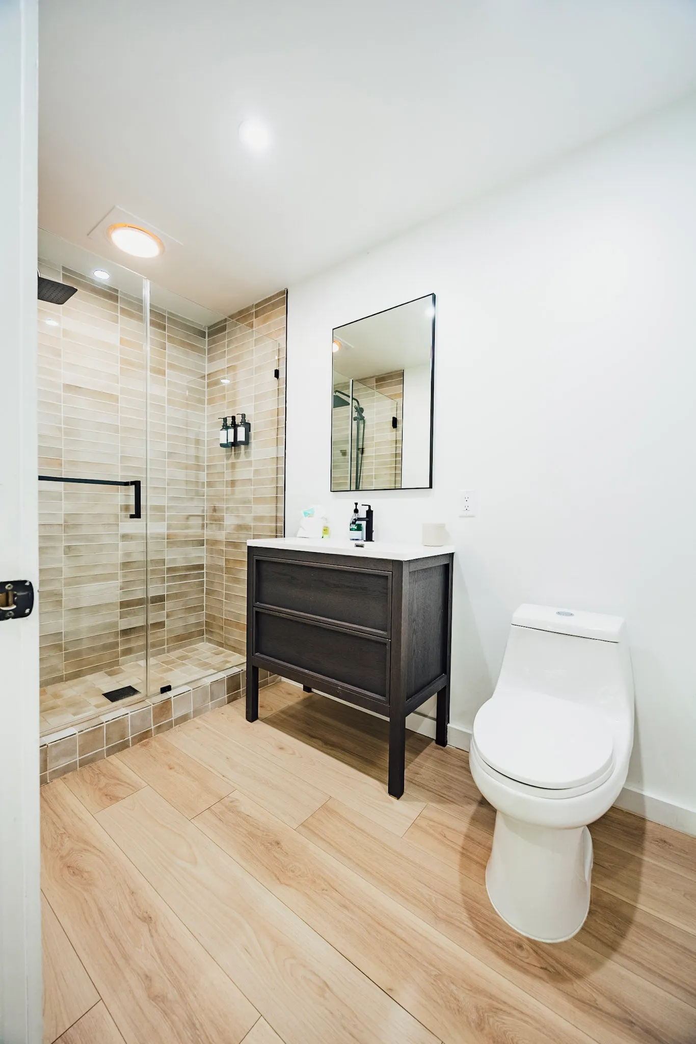 Bathroom with walk in glass shower and vanity at Nordic Haus
