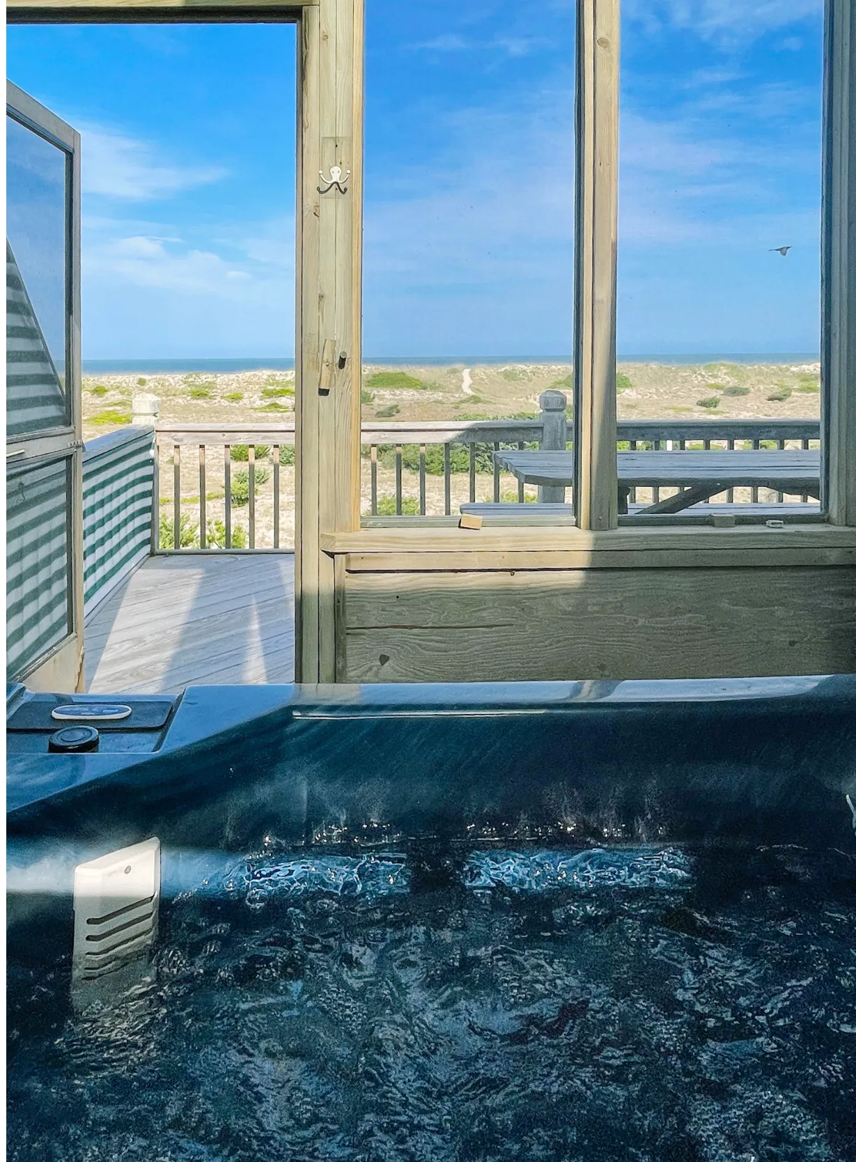 Hot tub with picnic table view at Dune Haus