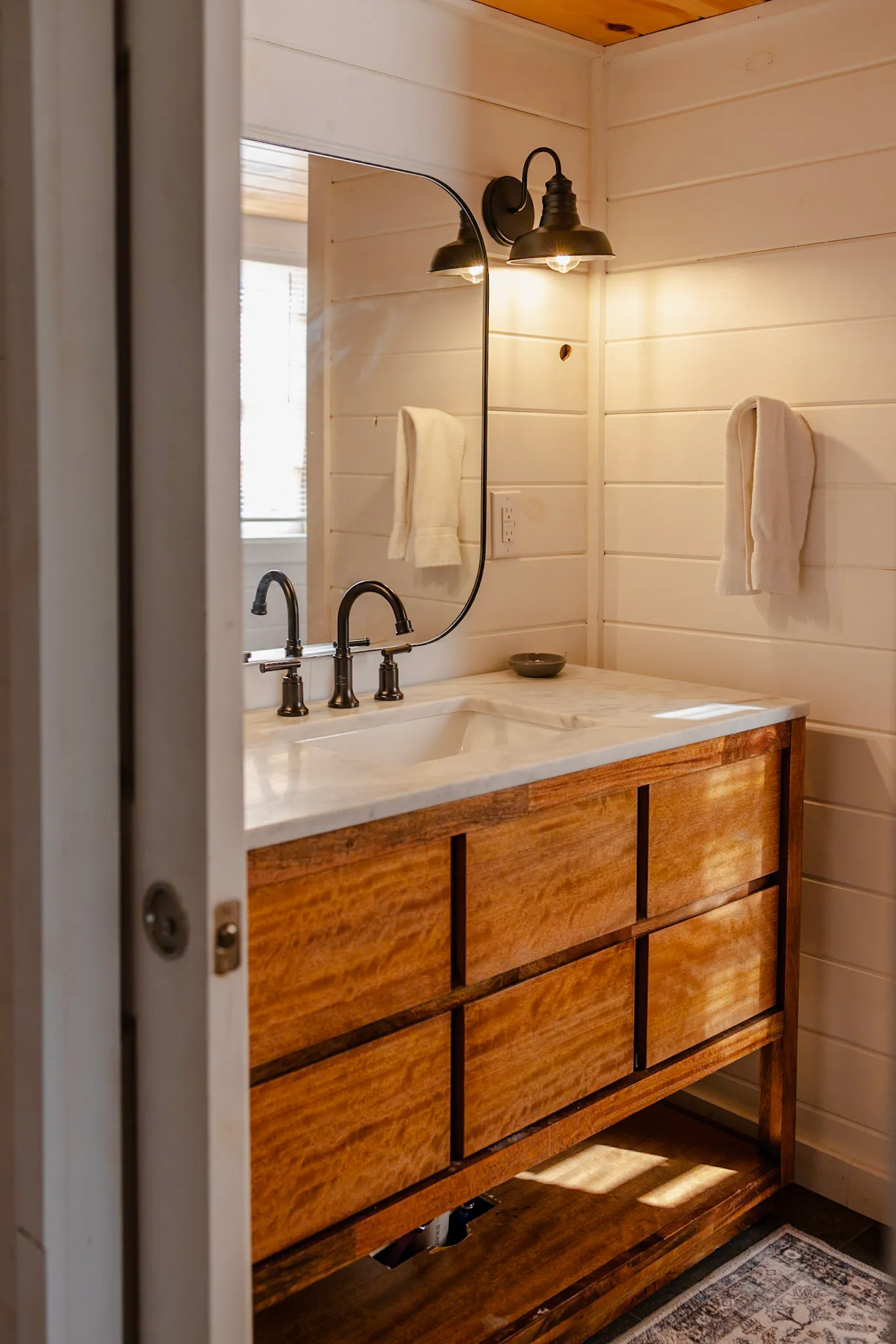Bathroom two wood vanity with marble top at Après Chalet