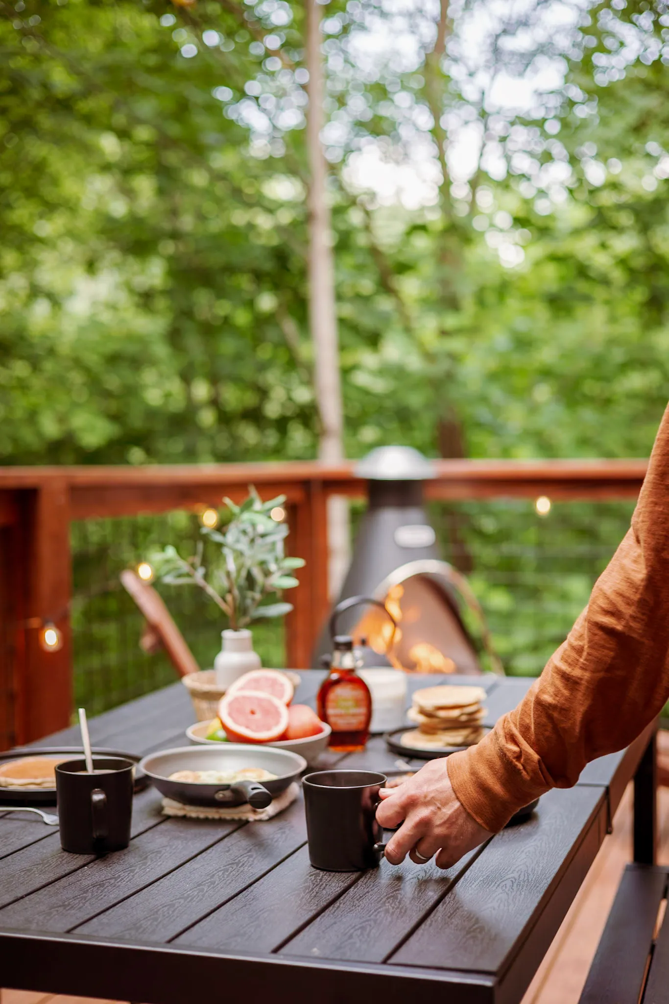 Breakfast spread with coffee on the deck table at Nordic Haus