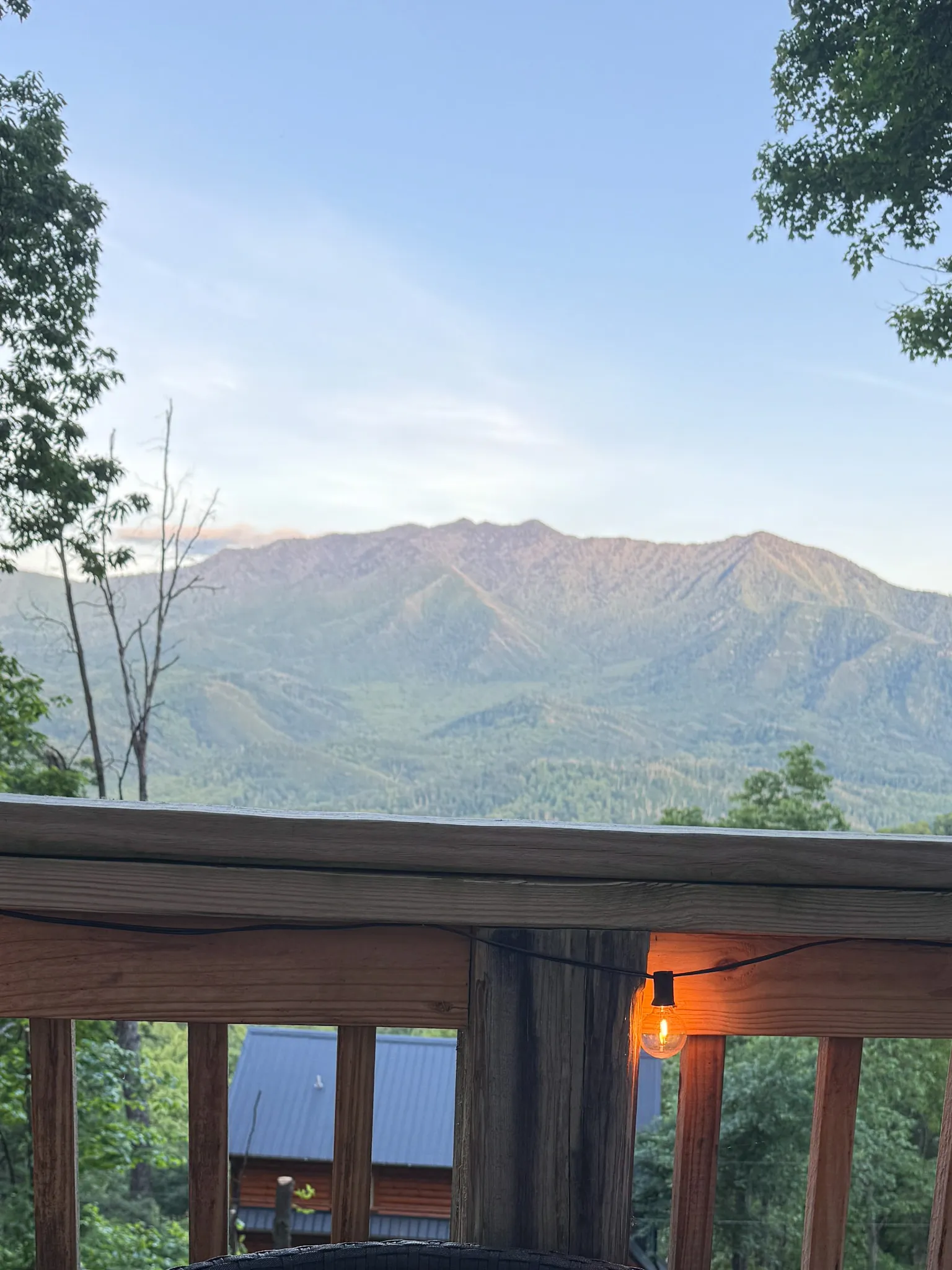 Mt leconte view from the deck railing at golden hour at Little Green Cabin